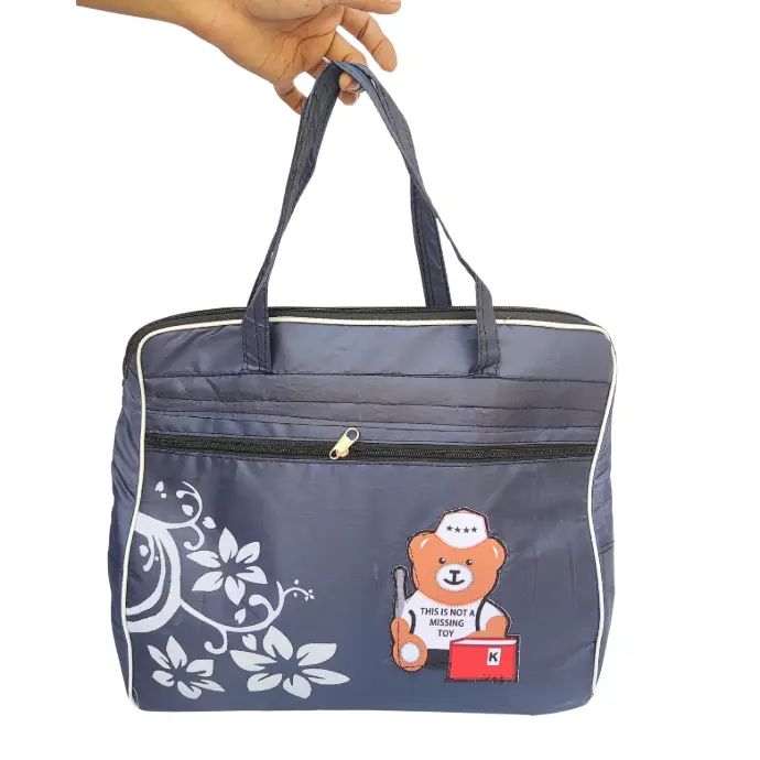 A fun and practical navy blue tote bag featuring an adorable teddy bear patch that says &#34;THIS IS NOT A MISSING TOY.&#34; Perfect for children to carry toys, school projects, or overnight clothes.